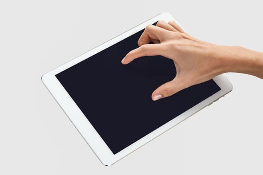 Finger touching digital tablet screen