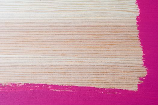 Hand-painted L-shaped border on two sides of a wooden plank with copy space