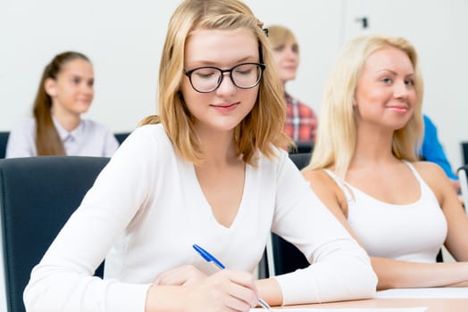 image of a young female students in the classroom, teaching at the University of