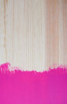 Splash of colour on wooden board with one painted end