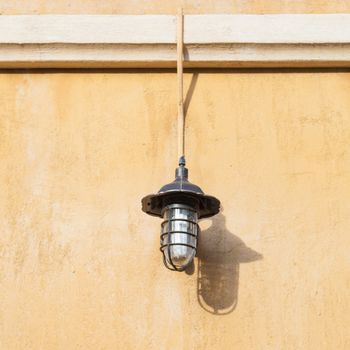 Lamp on the wall Russet walls Lanterns adorn a wall.