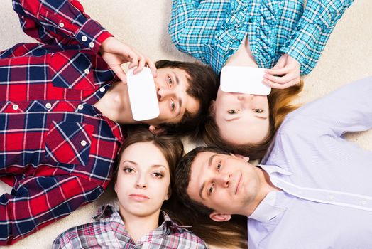 four young men lie together, applied to the face blank card