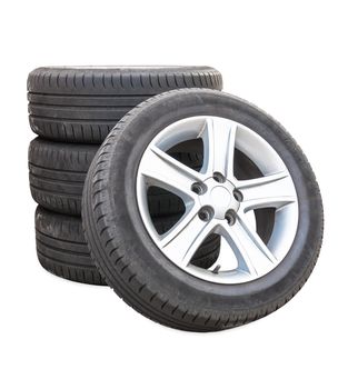 Four car tires isolated on white background with clipping path