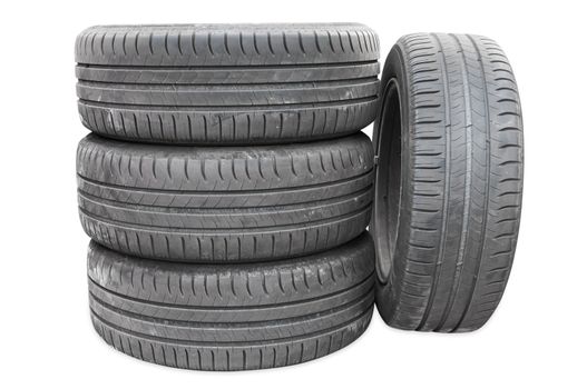 Four car tires isolated on white background with clipping path