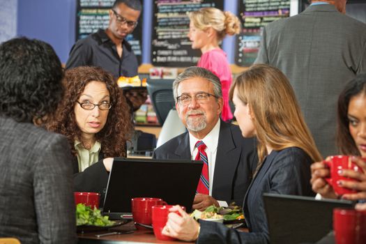 Adult business people meeting in a coffee house