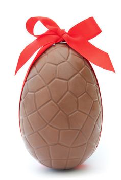 Chocolate easter egg with decorative red ribbon 