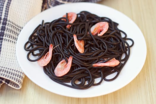 Black tagliatelle (pasta made with cuttlefish ink) with shrimp