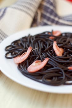 Black tagliatelle (pasta made with cuttlefish ink) with shrimp