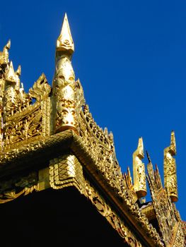 the complicated detail of wooden gate entrance at Wat Sri Chum,Lampang,Thailand