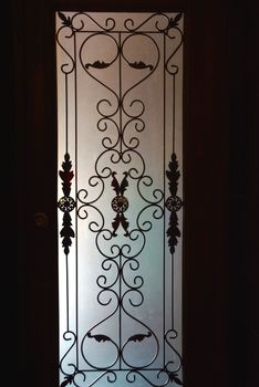 silhouette shadow against the glass door