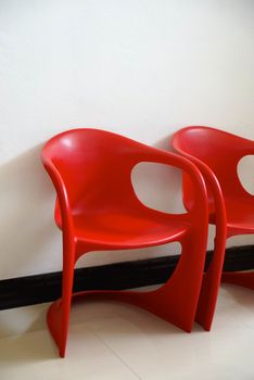 fiber red chairs on white background