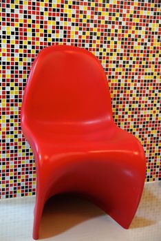 fiber red chairs on colourful background