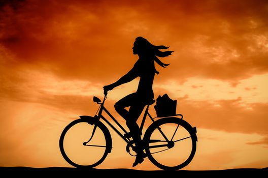 Retro Styled Photo Of A Girl On A Bike At Sunset