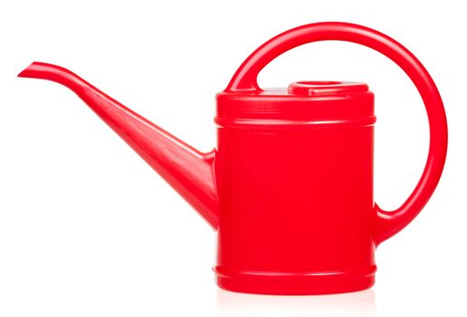 Red plastic watering can on white background