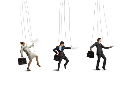 business people puppets hanging by a thread