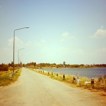 Road on reservoir with retro filter effect
