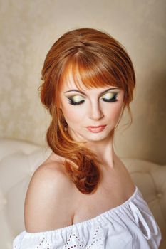 Attractive young bride with a wedding hair and makeup