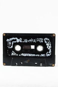 Ancient Vintage Used Musicassette over a White Background