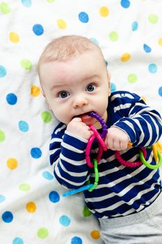 Funny cute blue-eyed baby. Little boy astonished