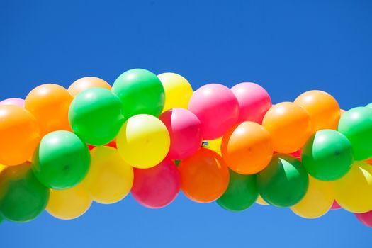 bright balloons and blue sky