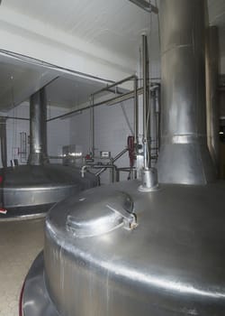 Rustproof brewing vessels at Van Honsebrouck brewery in Belgium, circa 2014. Closest one is mash tun, and the other the boiling tun.