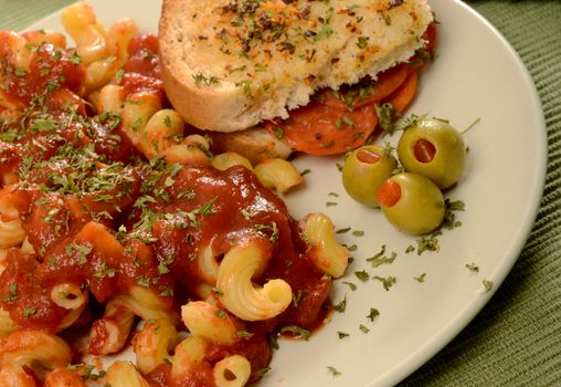 pasta with tomato sauce and pepperoni sandwich