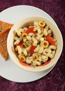 pepperoni pasta and garlic bread at restaurant