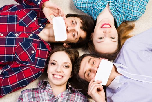 four young men lie together, applied to the face blank card