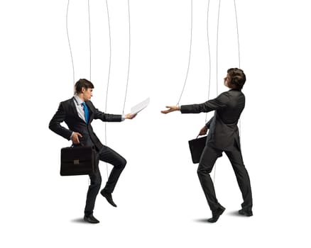 image of a two businessman puppet doll pass each other business papers