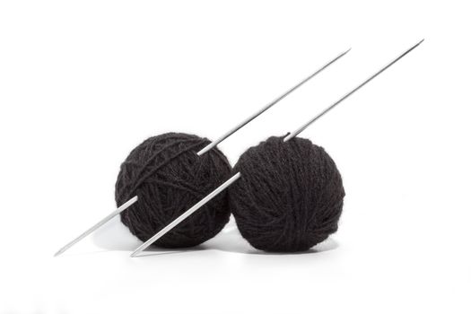 balls of yarn and knitting needles isolated