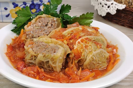 stuffed savoy cabbage under onion-carrot gravy