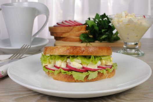 egg sandwich with lettuce radish under