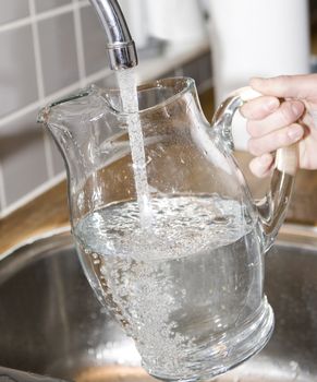 Filling water in a Glass Carafe