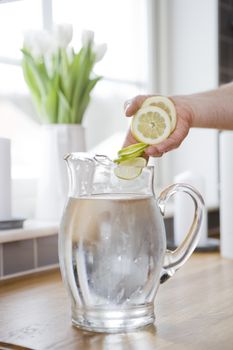 Water carafe with lemon and lime
