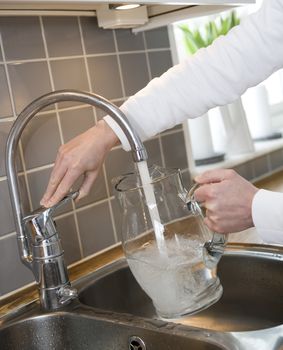 Filling water in a Glass Carafe