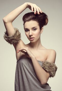 fashion portarit of nice pretty girl with fur and creative hairstyle color in fashion