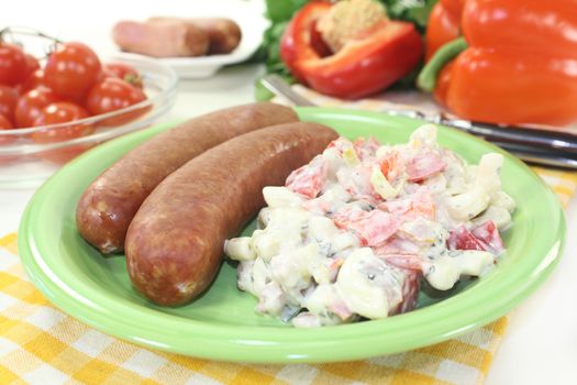 ham crackers with pasta salad against white background