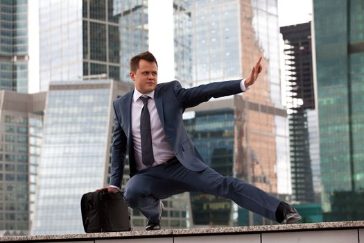 businessman in a defensive stance