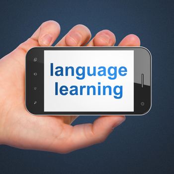 Education concept: hand holding smartphone with word Language Learning on display. Mobile smart phone on Blue background, 3d render
