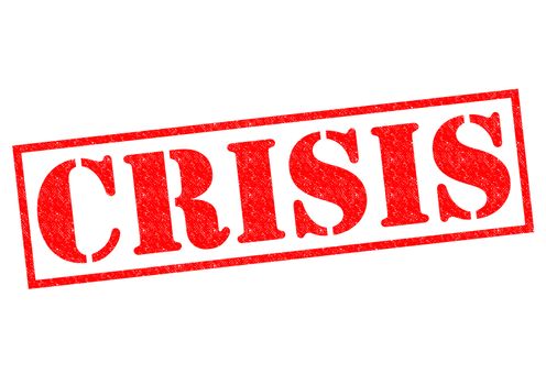 CRISIS red Rubber Stamp over a white background.