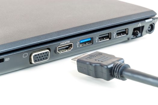 Plugging in modern HDMI cable to laptop