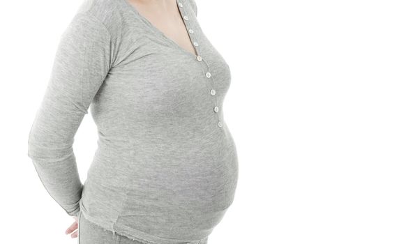 Closeup of pregnant woman at white background