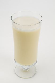 Vanilla milkshake against a white background