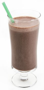 Chocolate milkshake with a green straw against a white background