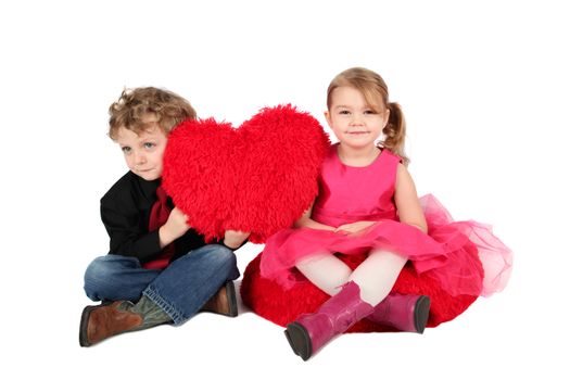 Young boy and girl holding a valentine heart
