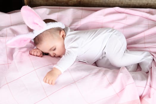 Sleeping easter bunny baby wearing fluffy ears