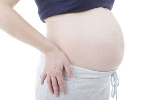 Closeup of pregnant woman at white background