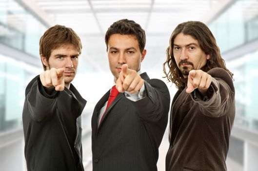 three business men pointing, at the office