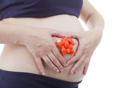 Closeup of pregnant woman at white background