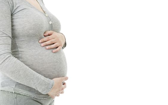 Closeup of pregnant woman at white background